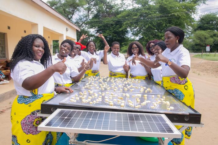 Women working with a solar dryer